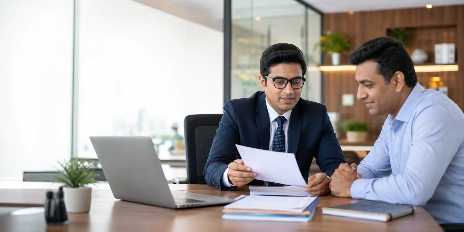 Chartered accountant explaining financial documents to a client