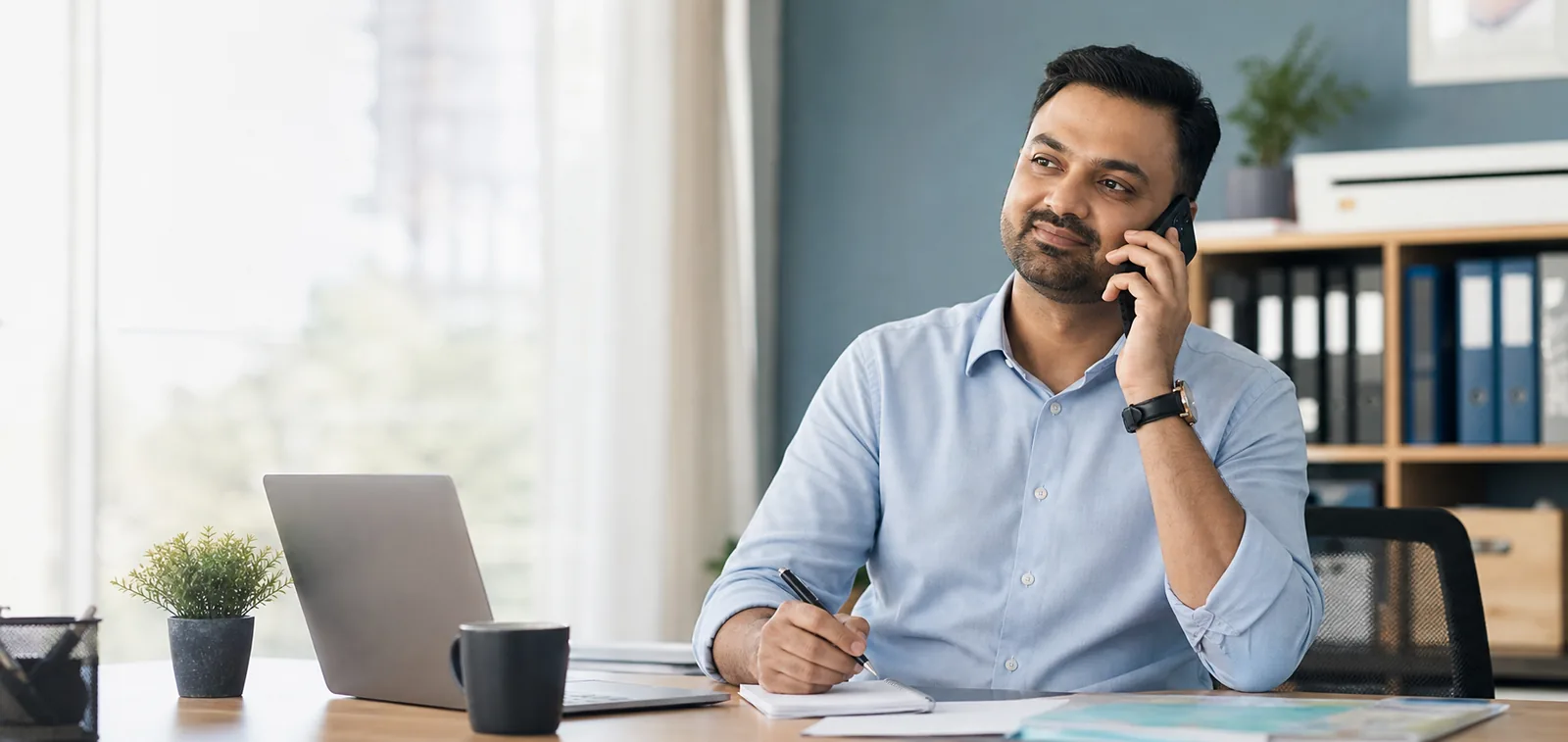 Business client speaking with a chartered accountant by phone